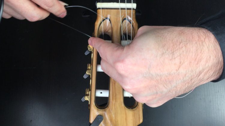 1st string creating loop at headstock