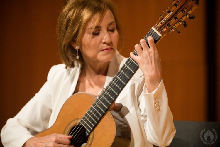 A guitarist playing at CGC Summer School