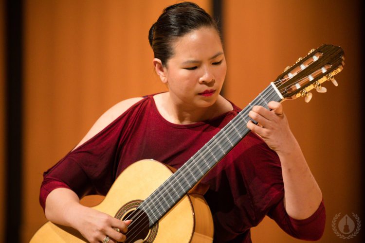 A guitarist performing at CGC Summer School